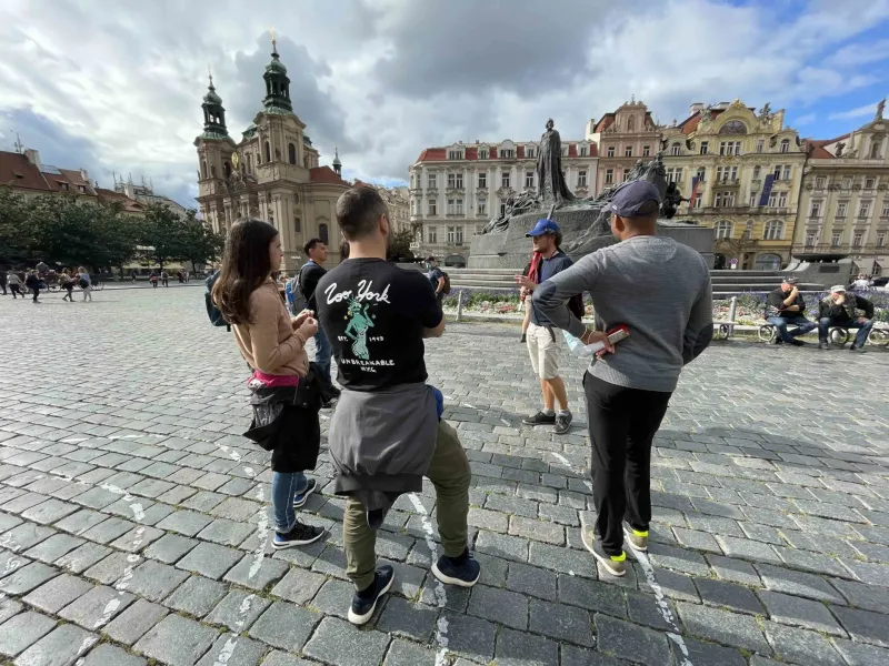 Guided tour group in Prague's Old Town Square.