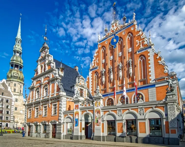 Explore Riga's Old Town: House of the Blackheads & St. Peter's Church.