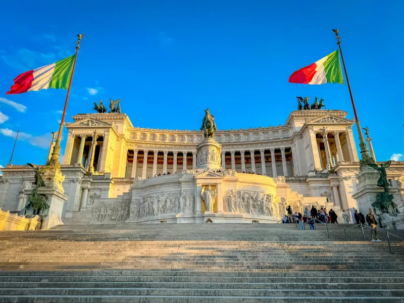 Tourists ascending the grand staircase of the Vittoriano monument in Rome, Italy.