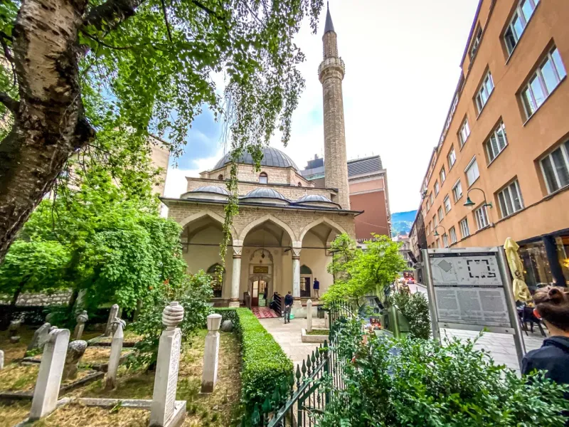 A tour group visits the historic Gazi Husrev-beg Mosque in Sarajevo.