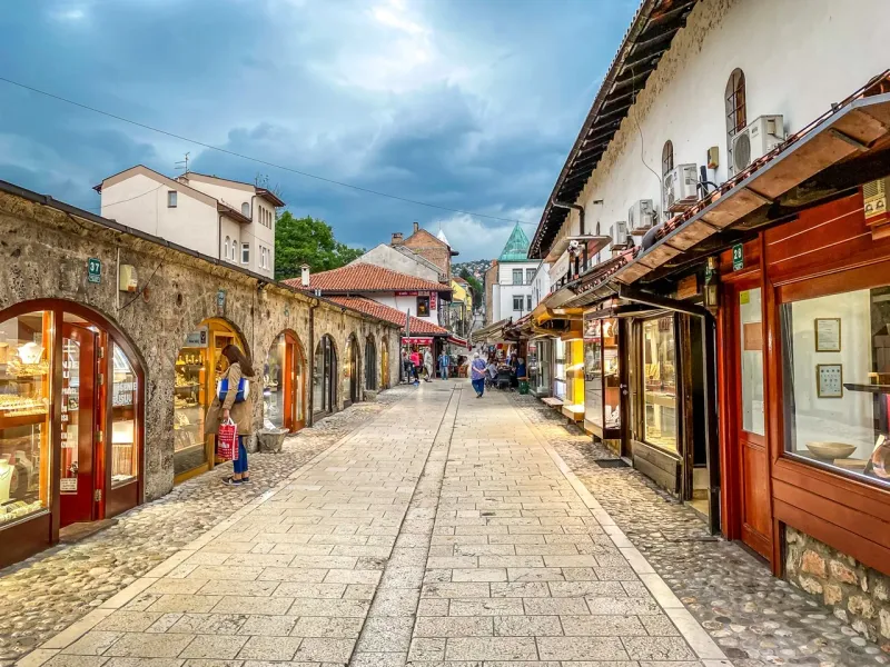 Picturesque street in Sarajevo's Old Town with traditional shops.