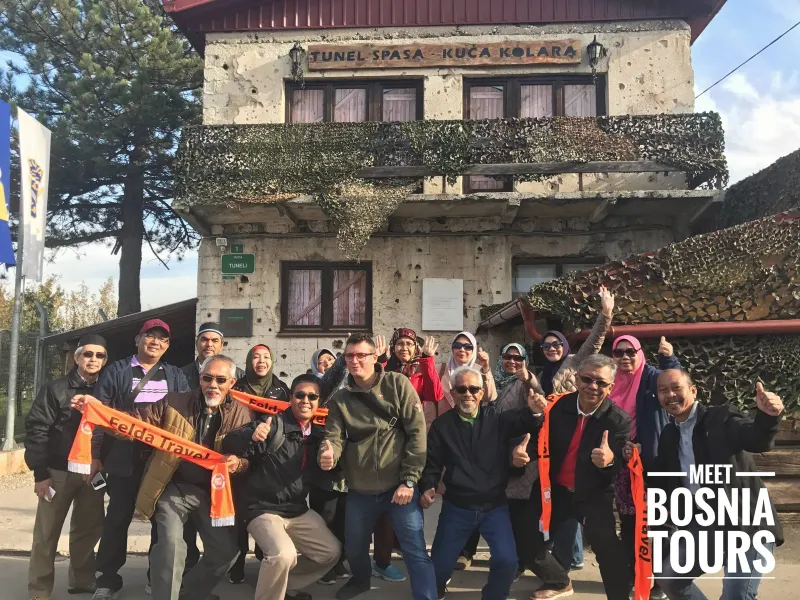 Happy tour group at the Tunnel of Hope in Sarajevo.