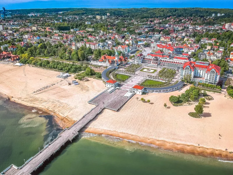 Aerial view of Sopot, Poland, showcasing its beautiful beach, pier, and cityscape.