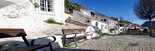 Picturesque Spanish village with whitewashed houses and cobblestone streets.