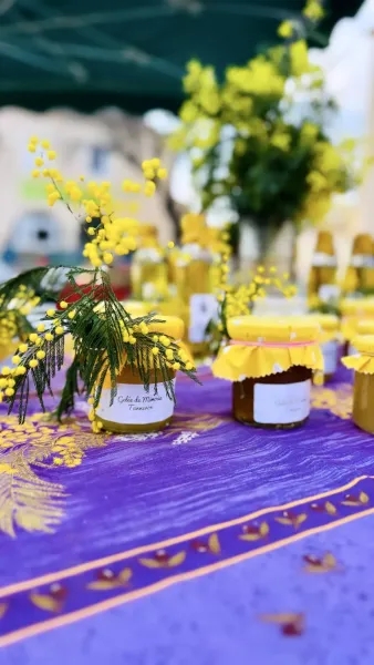 Jars of mimosa jelly at a market in Tanneron, France.