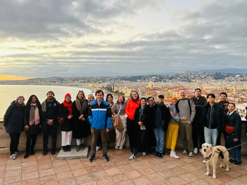Group of tourists enjoying a panoramic view of Nice.