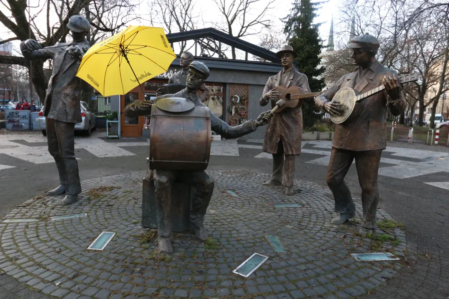Bronze statue of a street band in Warsaw, Poland.