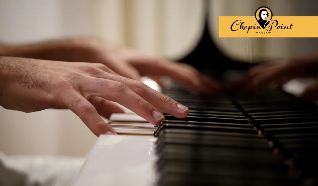 Hands playing a piano at a Chopin Point Warsaw concert.