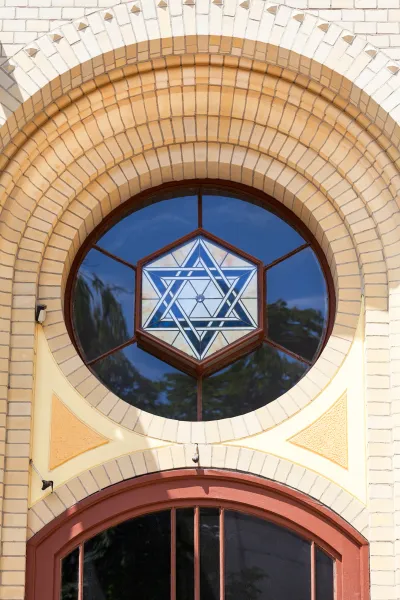 Close-up of a beautiful stained-glass Star of David in a circular window of a building in Wrocław, Poland.