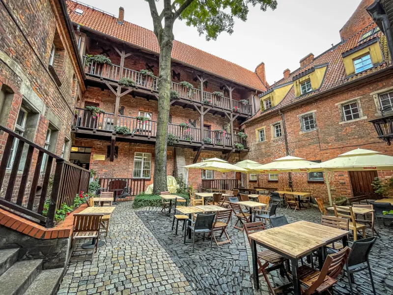 Charming courtyard restaurant in Wrocław, Germany.