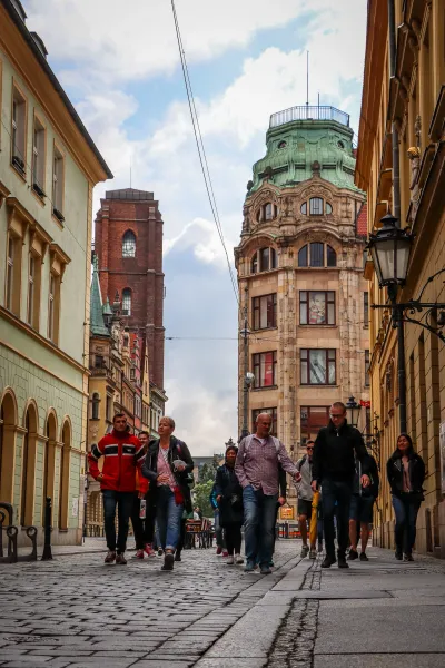 Tourists on a walking tour in Wrocław, Poland.