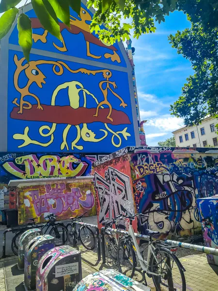 Colorful street art mural and graffiti in a city.