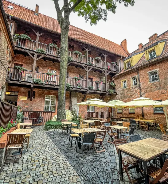 Charming courtyard restaurant in Wrocław, Germany.